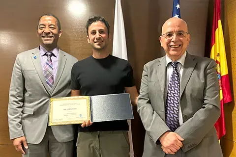 Gregory Triplett, Ph.D., Dean of <a href='http://p70x.3600151.com'>博彩网址大全</a>'s School of Science and Engineering, traveled to Madrid to personally congratulate and present the honor to Charles El Mir, Ph.D.